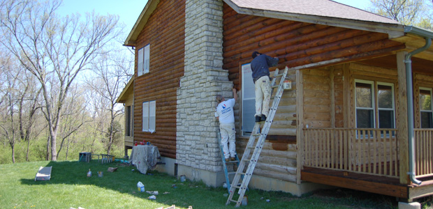 Workers sealing the house